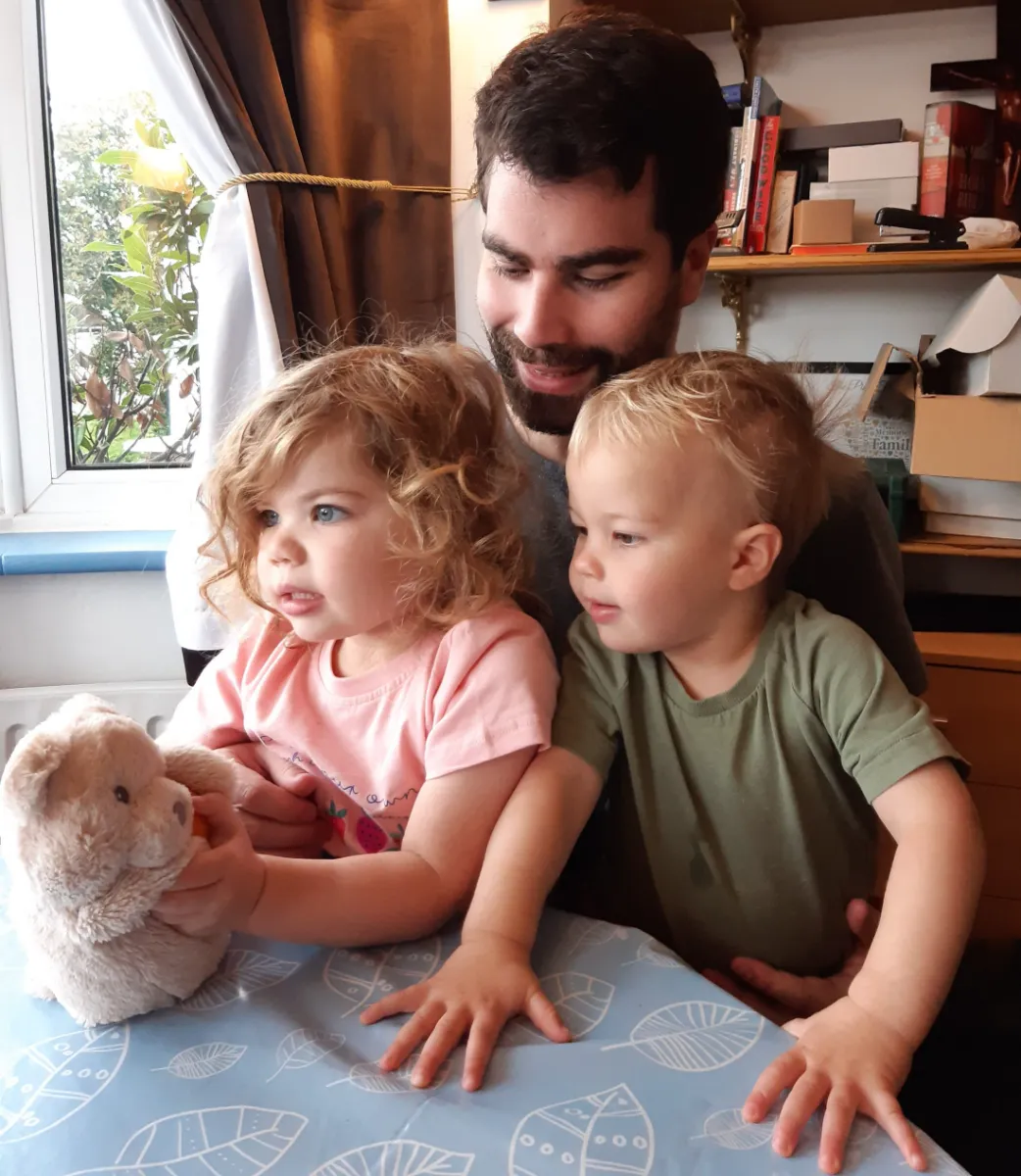 Our dad at home with the two of us when we were little